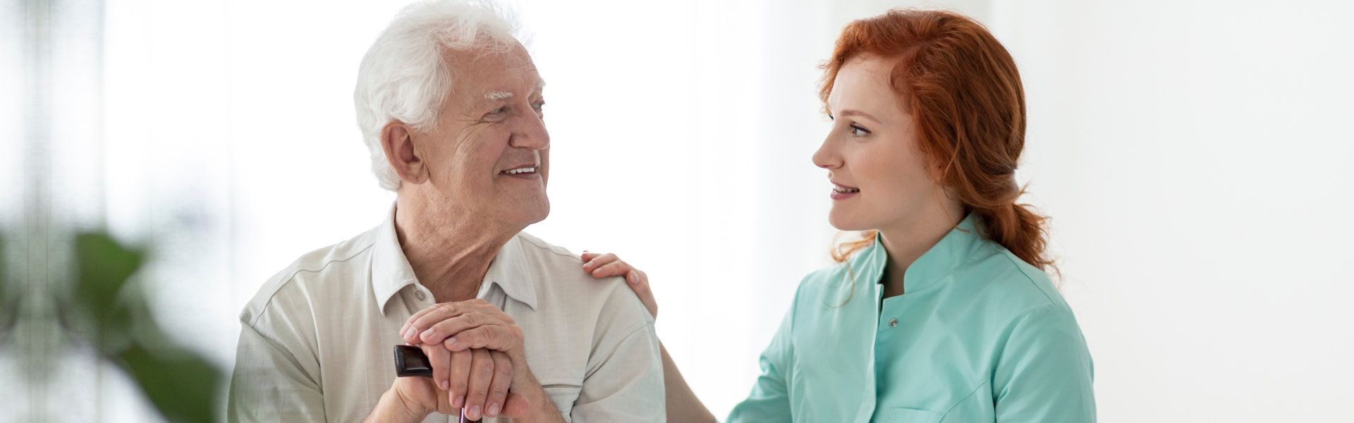 caregiver woman accompanying a senior man