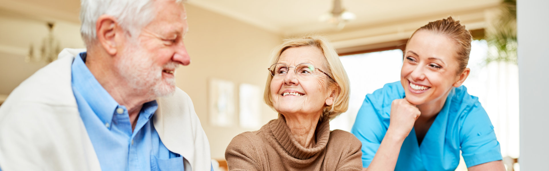 caregiver woman with a senior couple