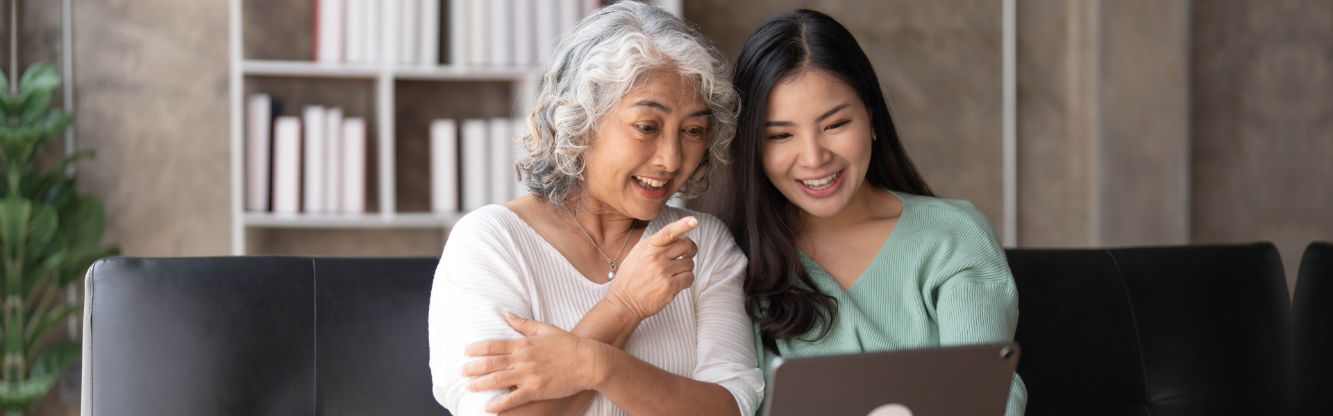 lady with her mother using a laptop